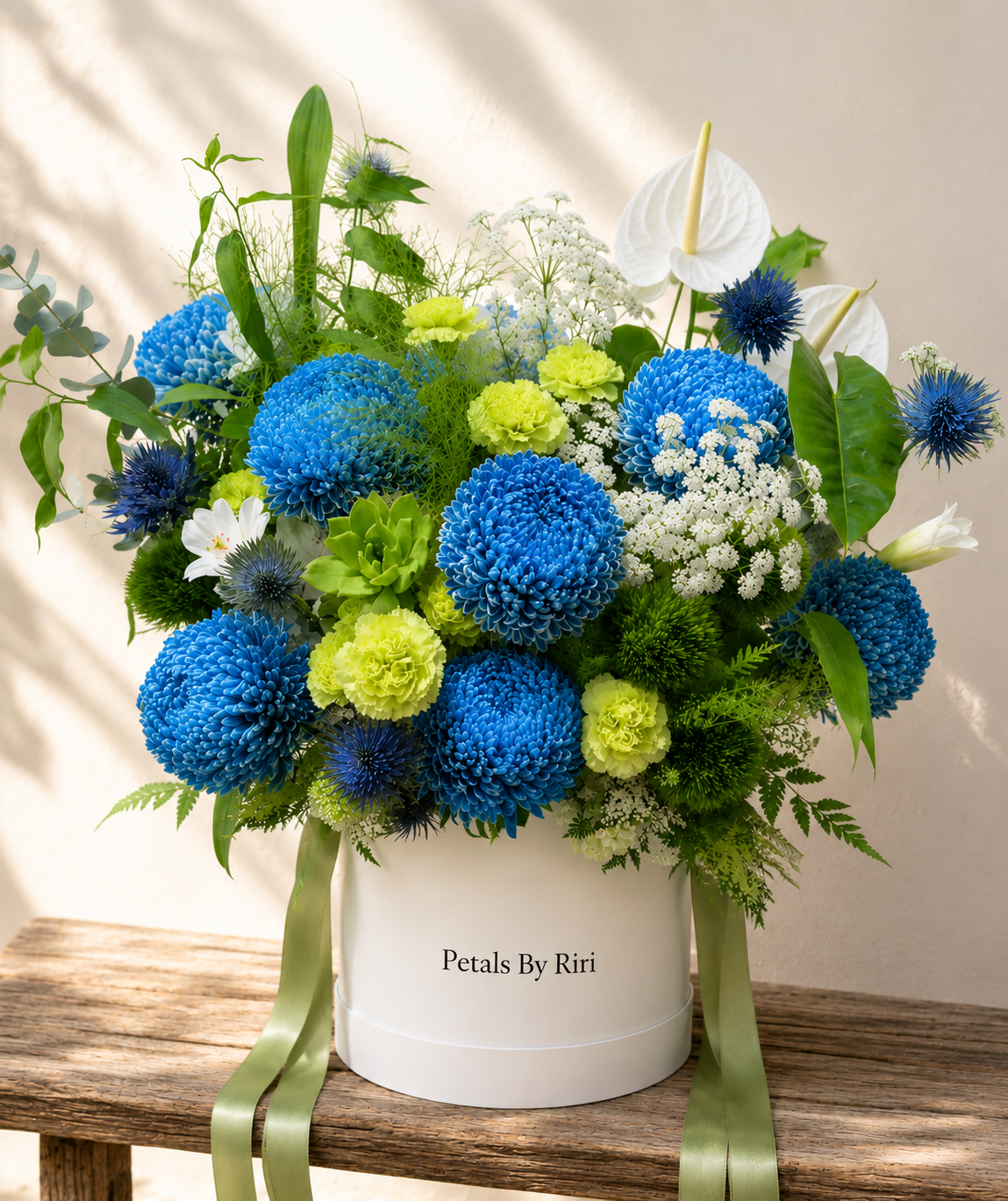 Azure Garden luxury blue floral hatbox arrangement – Petals by Riri Dubai