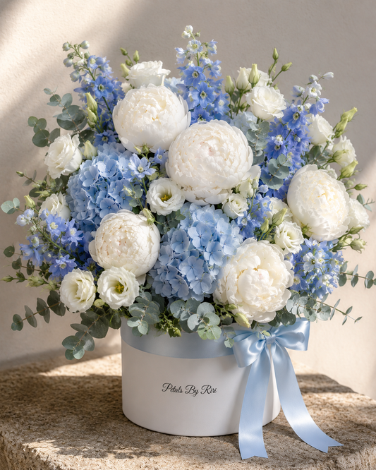 Cloud & Sky luxury white and blue hatbox arrangement – Petals by Riri Dubai